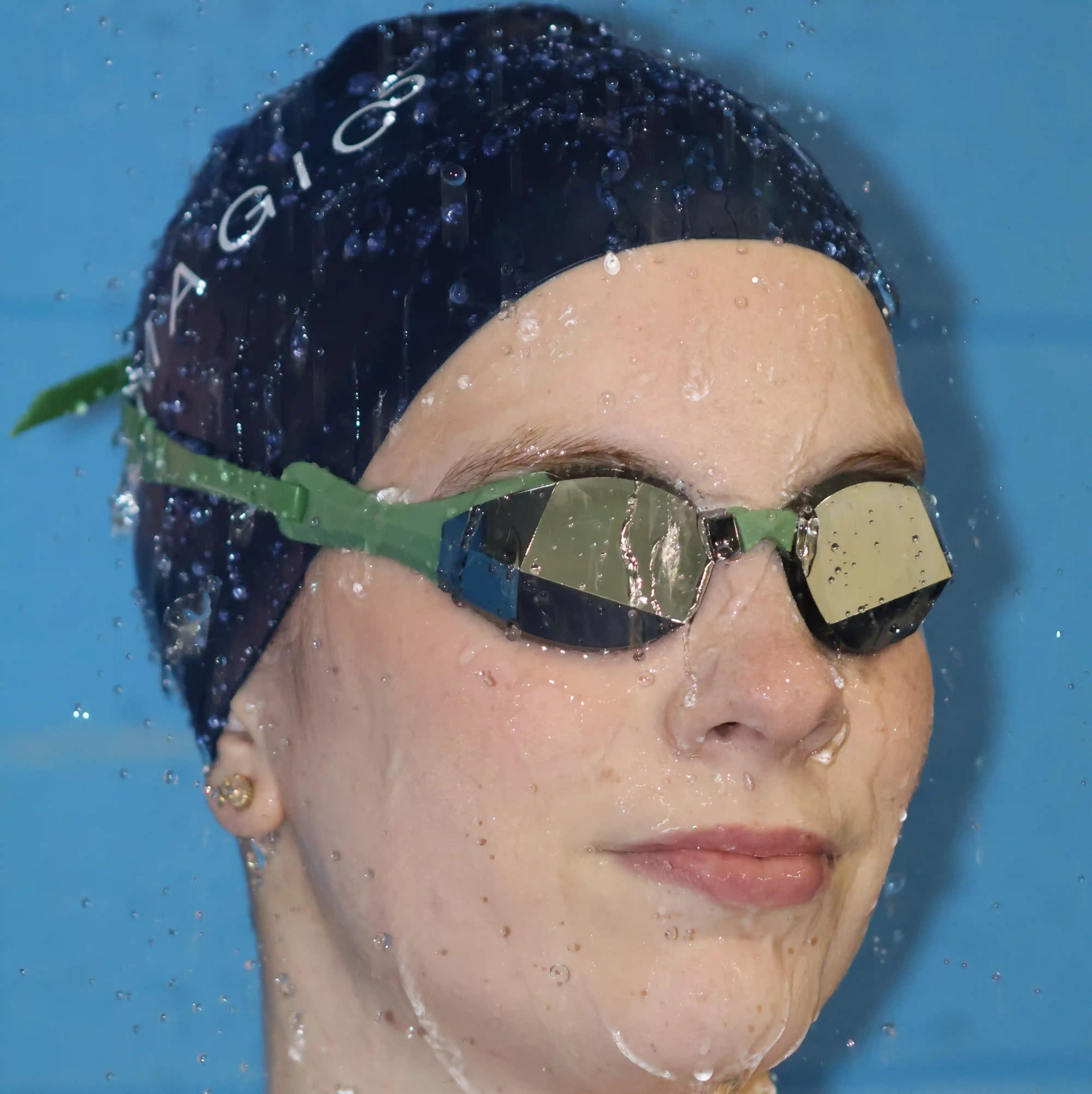 Swimmer wearing limited edition green silver goggles