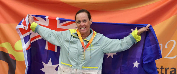 Sue Thompson holding an Australian flag