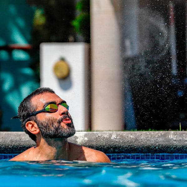 Man wearing the magic 5 goggles in the pool
