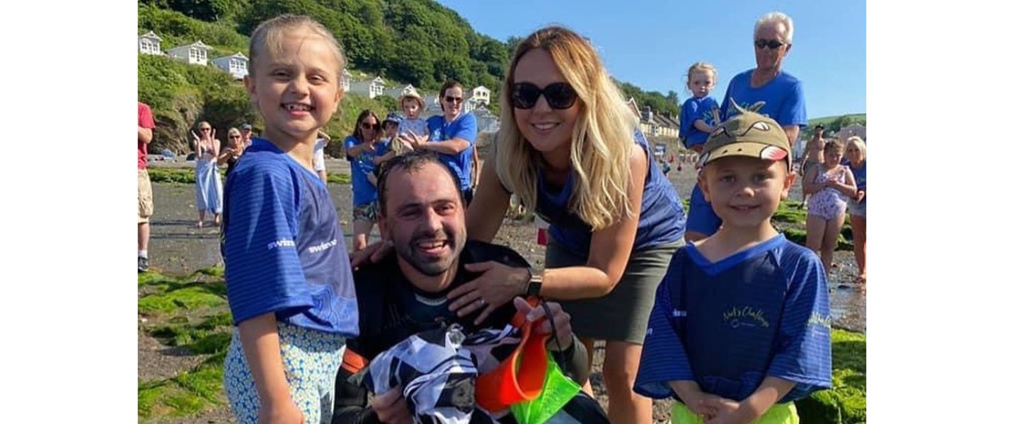 Neil Gilson with his family after a swim