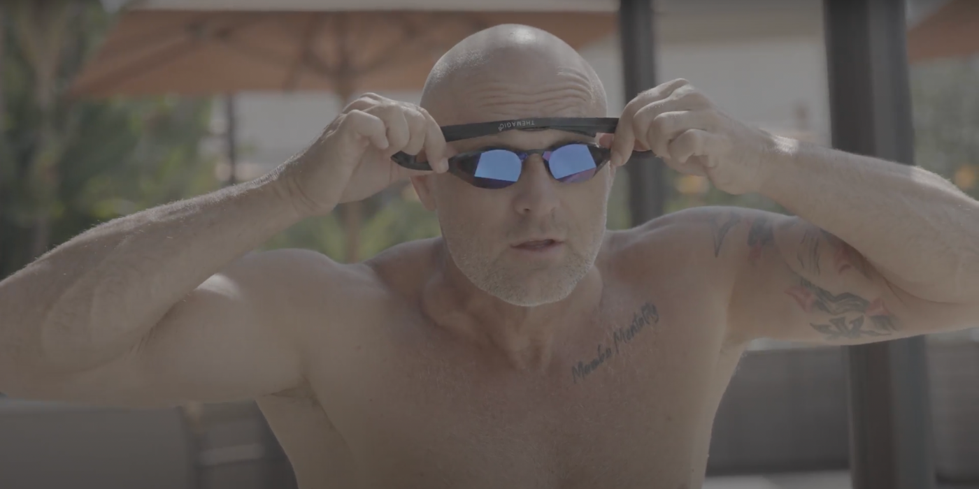 Brett Hawke putting on custom-fitted swimming goggles