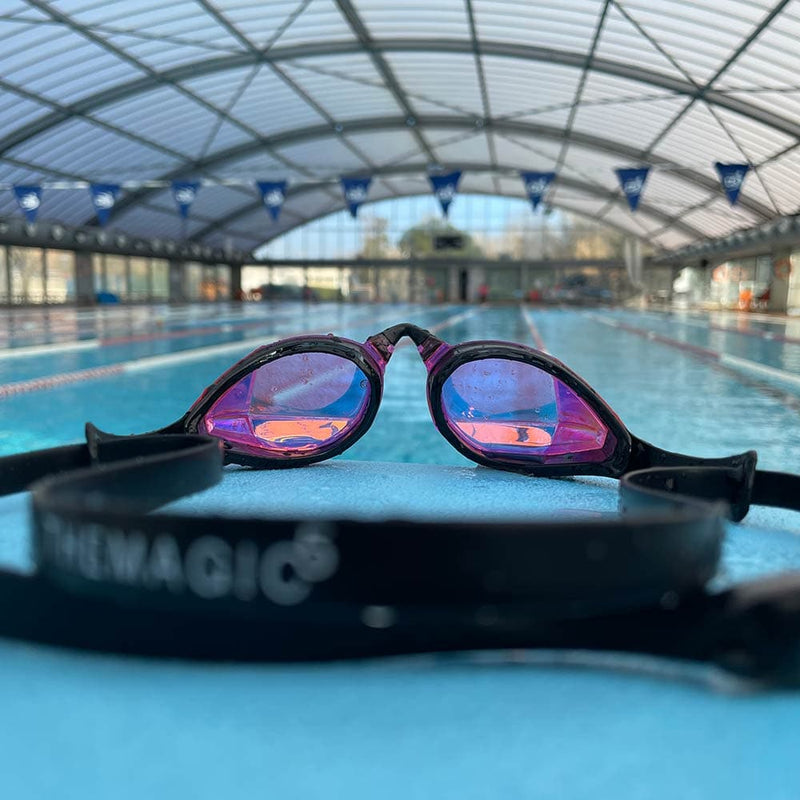 Limited Edition Pink Gold goggles on pool deck